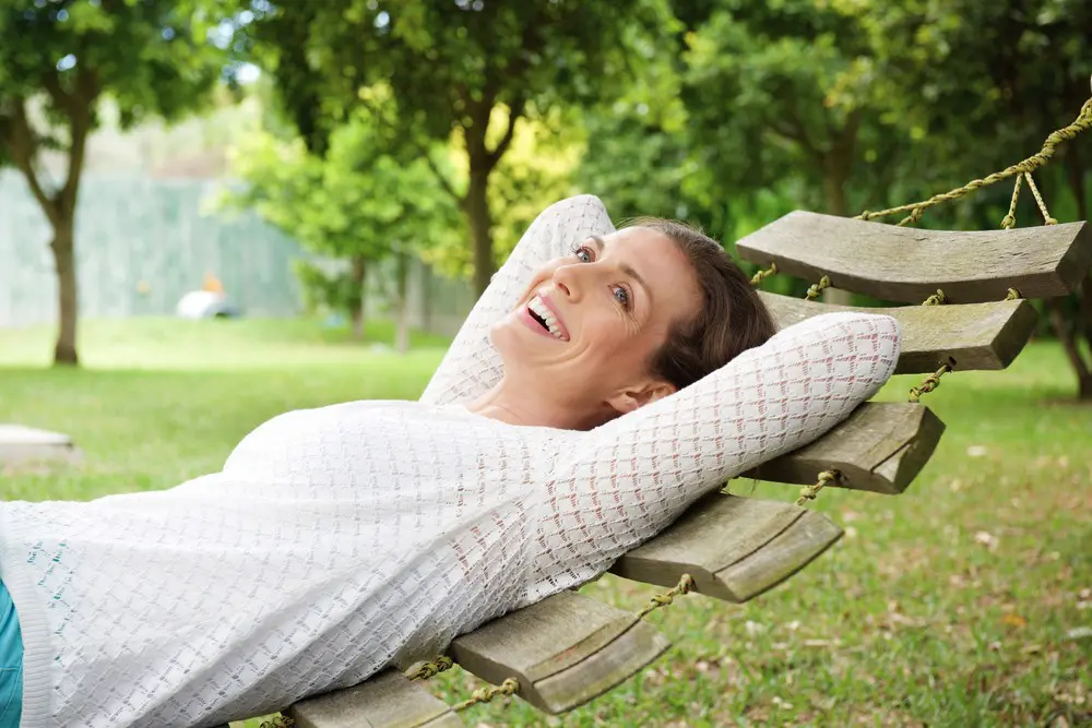 woman smiling on a swing
