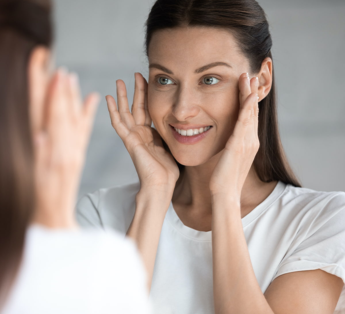 woman looking in the mirror