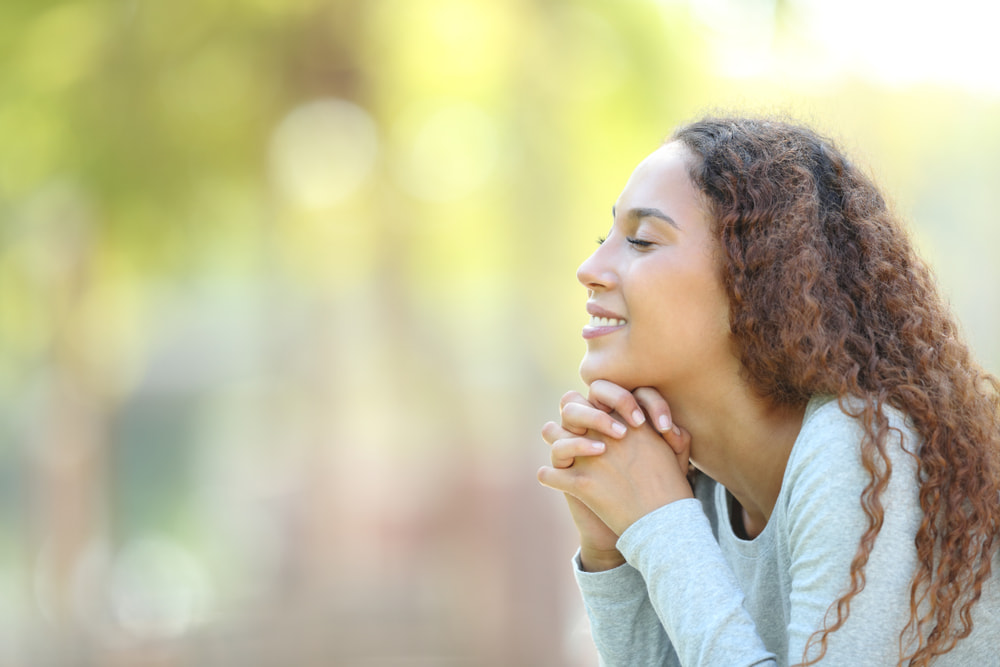 woman taking a deep breath