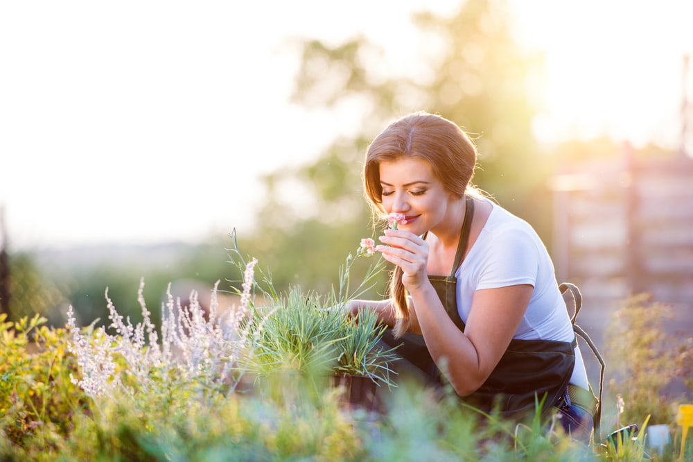 woman smelling her garden