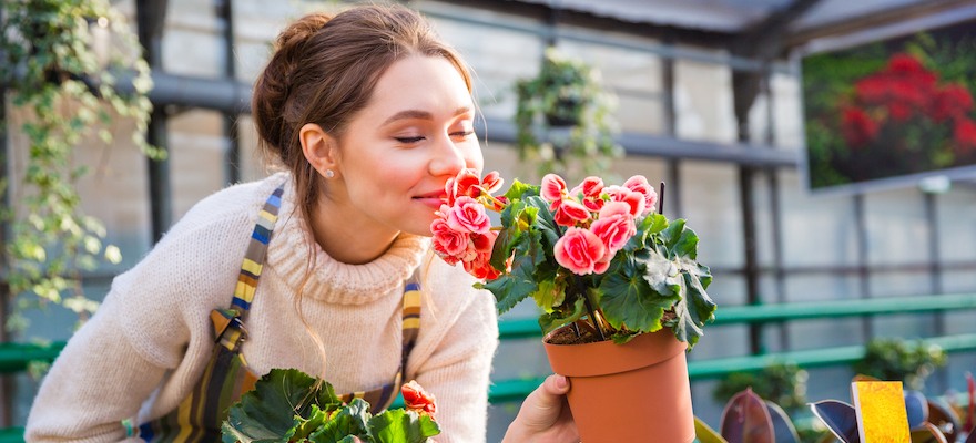 woman smelling flowers